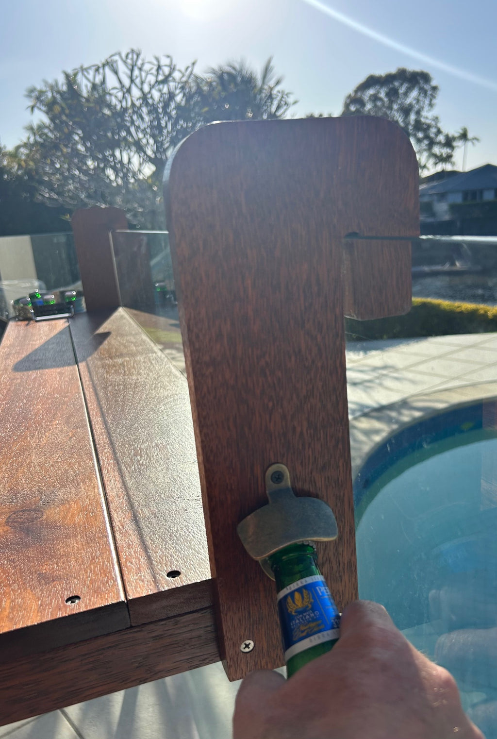 Beer being opened on The Bench Bar