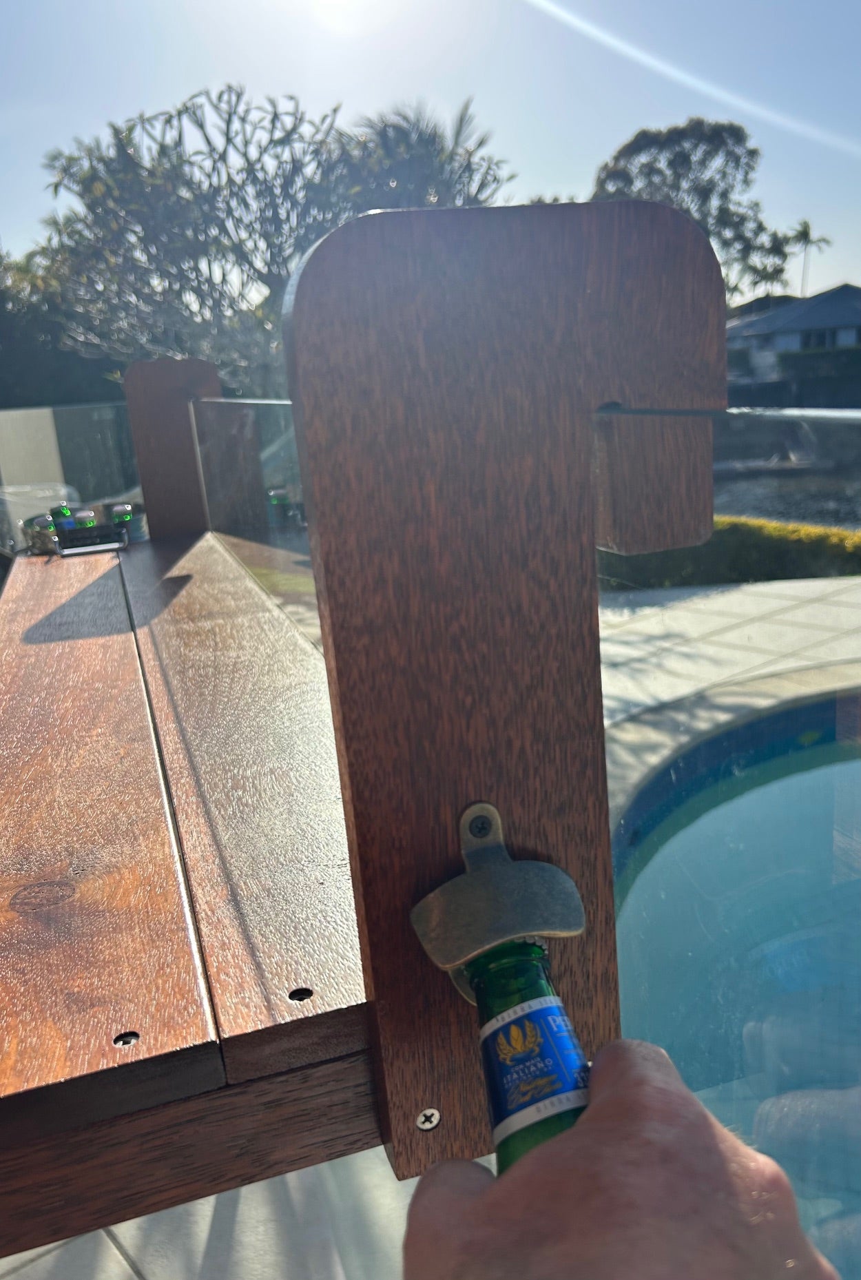 Beer being opened on The Bench Bar