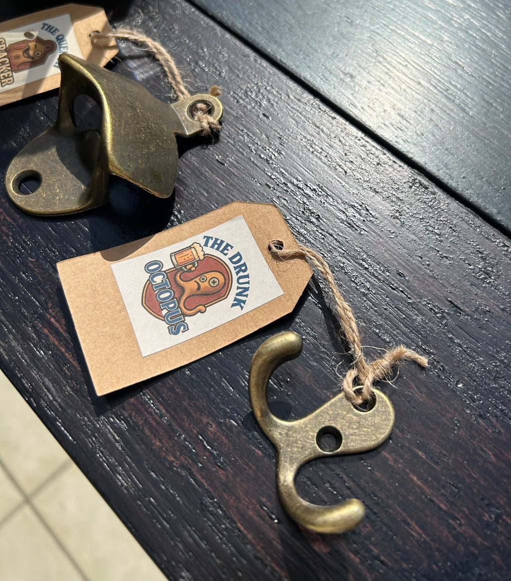 Brass bottle opener with 'The Drunk Octopus tag on a wooden surface