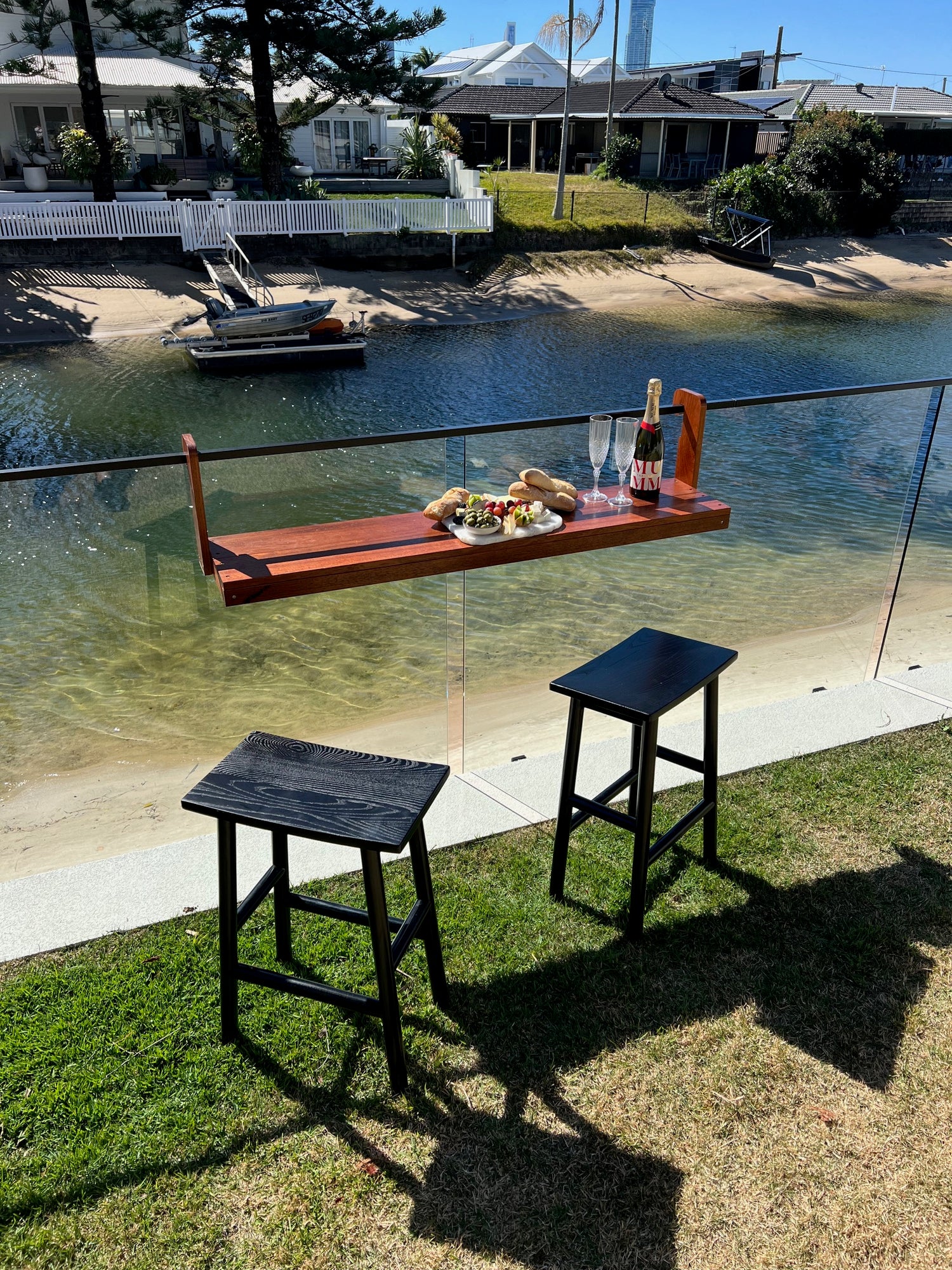 Outdoor setting with a table and chairs on a patio area.